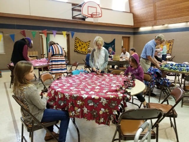 Picture of congregation members making blankets